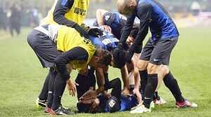 Inter Milan's Schelotto celebrates with teammates after scoring against AC Milan during their Italian Serie A soccer match in Milan