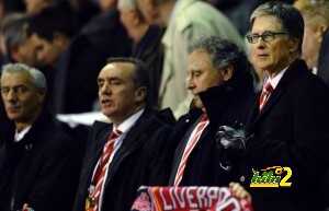 Liverpool co-owner John Henry (R) arrive