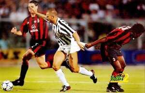 Juventus forward Marco Di Vaio (C) is ta