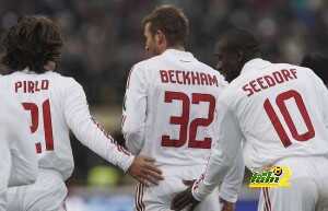 AC Milan's Andrea Pirlo (L) and Clarance