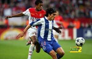 Monaco's defender Patrice Evra (L) tries