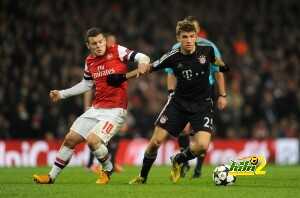 Jack Wilshere of Arsenal and Thomas Muller of Bayern Munich