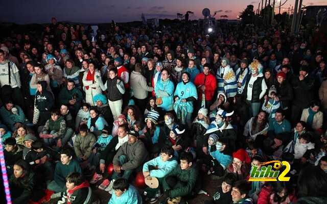 Hundreds of people gather outside the ho