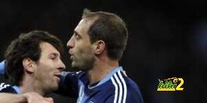 Argentina's forward Lionel Messi (L) celebrates his team's first goal with his teammate defender Pablo Zabaleta during the international friendly football match between Switzerland and Argentina in Bern on February 29, 2012.  AFP PHOTO / FABRICE COFFRINI (Photo credit should read FABRICE COFFRINI/AFP/Getty Images)