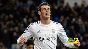 صورة : غاريث بيل يحتفل بألقابه الأربعة مع مدريد في 2014