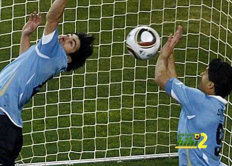 Uruguay's Luis Suarez saves the ball with his hands during a 2010 World Cup quarter-final soccer match at Soccer City stadium