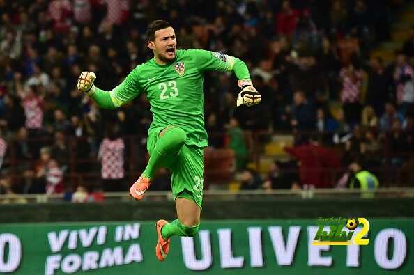 Croatia's goalkeeper Danijel Subasic celebrates after teammate Croatia's midfielder Ivan Perisic scores during the Euro 2016 qualifying football match Italy vs Croatia on November 16, 2014 at the San Siro stadium in Milan.     AFP PHOTO / GIUSEPPE CACACE        (Photo credit should read GIUSEPPE CACACE/AFP/Getty Images)