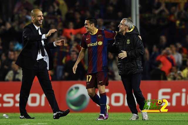 Barcelona's coach Josep Guardiola (L) and Barcelona's forward Pedro Rodriguez (C) celebrate after winning the Champions League semi-final second leg football match between Barcelona and Real Madrid at the Camp Nou stadium in Barcelona on May 3, 2011. Barcelona qualified for the Champions League final after drawing 1-1 in their semi-final second leg clash with bitter rivals Real Madrid to progress 3-1 on aggregate. AFP PHOTO / SIU WU (Photo credit should read SIU WU/AFP/Getty Images)