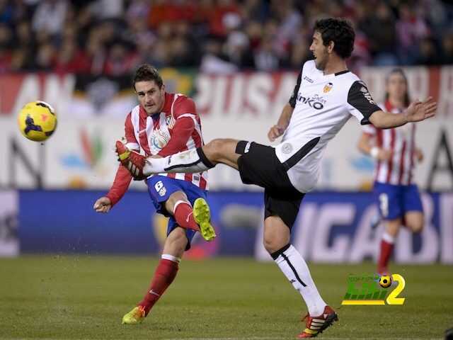 Atletico Madrid's midfielder Koke (L) vies with Valencia's midfielder Daniel Parejo during the Spanish league football match Club Atletico de Madrid vs Valencia CF at the Vicente Calderon stadium in Madrid on December 15, 2013. AFP PHOTO/ DANI POZO (Photo credit should read DANI POZO/AFP/Getty Images)