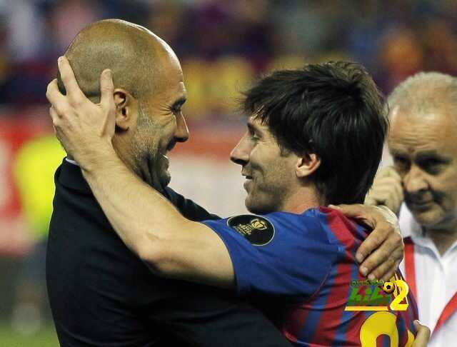 El argentino Lionel Messi, del Barcelona, celebra con el técnico Josep Guardiola tras la final de la Copa del Rey contra el Athletic de Bilbao en el estadio Vicente Calderon, en Madrid, España, el viernes 25 de mayo de 2012. El Barcelona ganó 3-0. (AP foto/Andrés Kudacki)